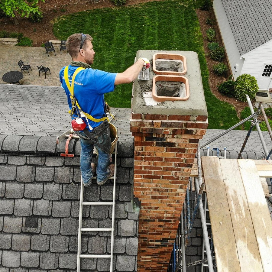 Cracked chimney crown and deteriorated masonry before repair in Highland Park, TX